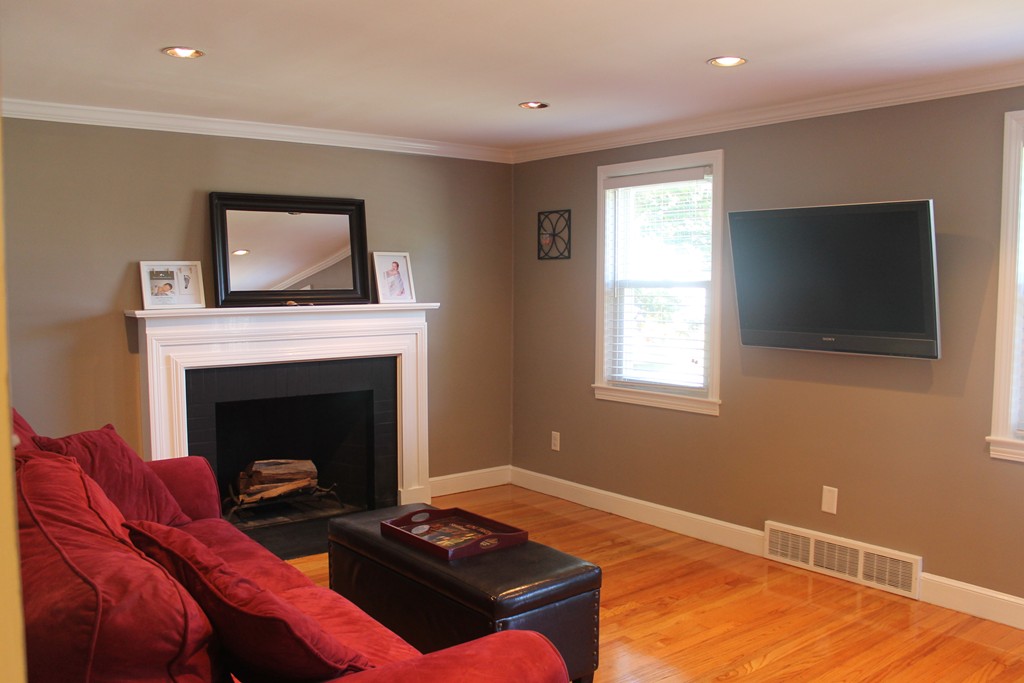 67 Colasanti Road Weymouth, MA 02191 - Photo 8 of 16 a living room with furniture and a fireplace