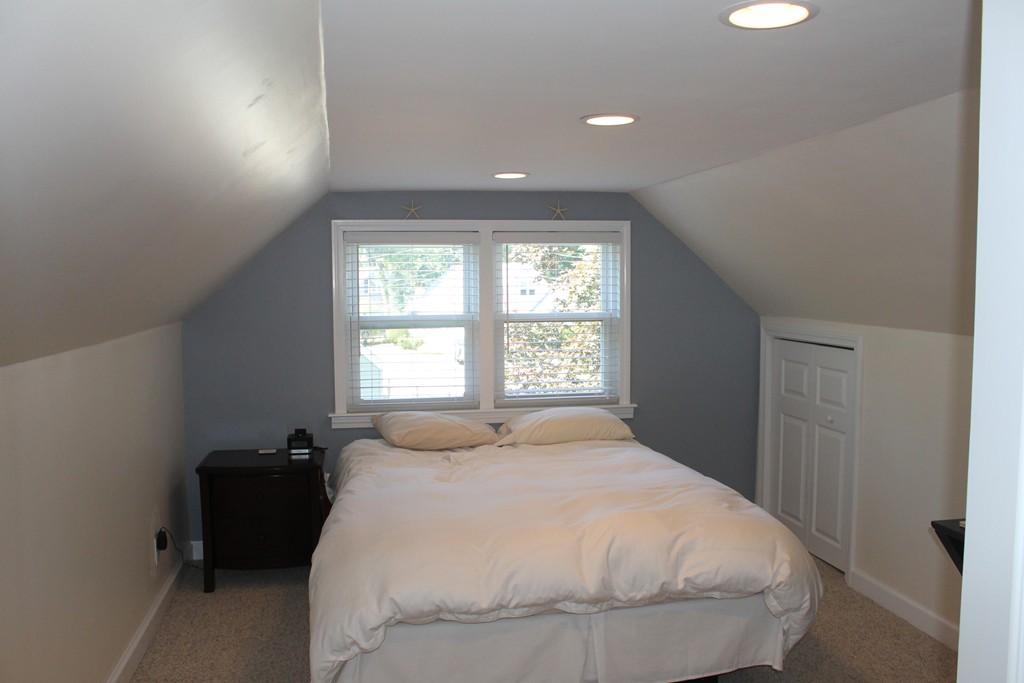 67 Colasanti Road Weymouth, MA 02191 - Photo 9 of 16 a bedroom with a bed and a window