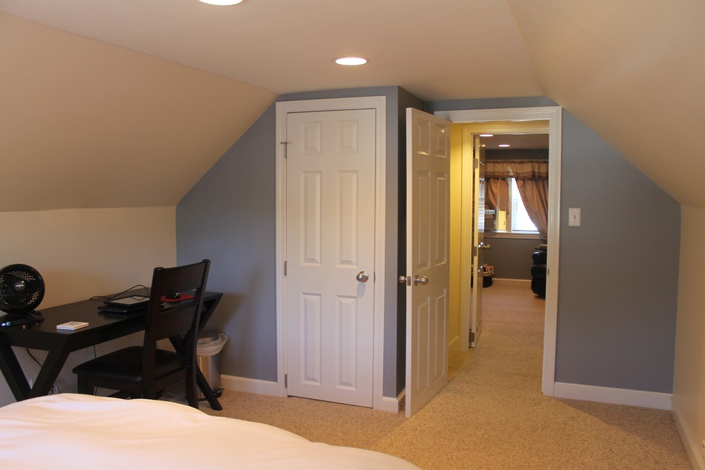 67 Colasanti Road Weymouth, MA 02191 - Photo 10 of 16 a bedroom with a bed and a table