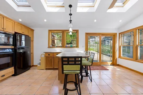 a dining room with furniture and window