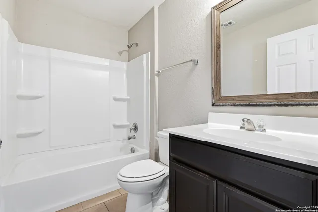 a bathroom with a sink a toilet and a bathtub