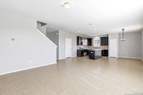 a view of a kitchen with a sink and a cabinet