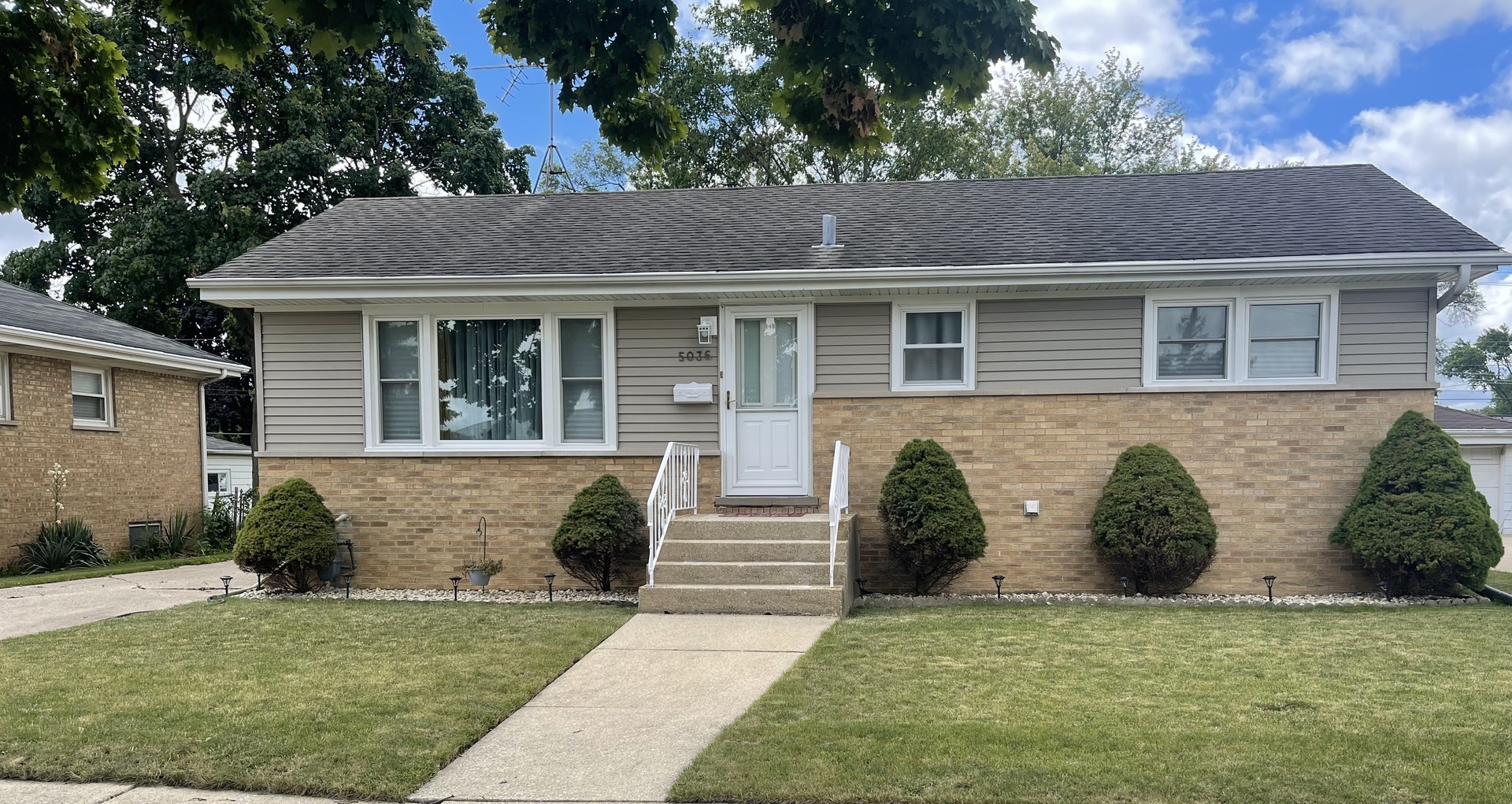 Undisclosed Address Hillside, IL 60162 - Photo 1 of 4 a front view of a house with garden