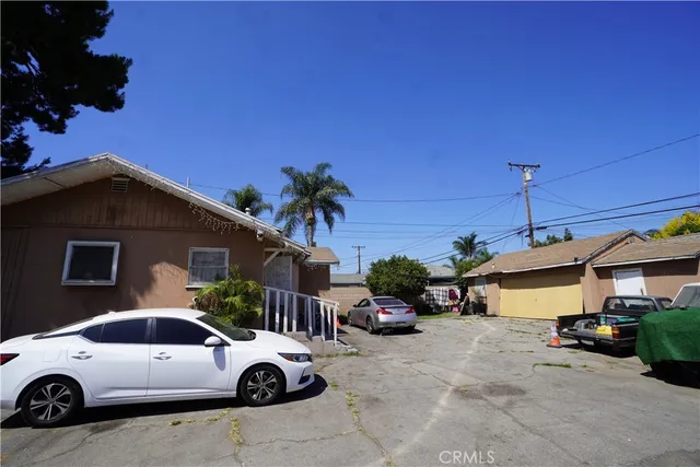 a view of a car parked in front of house