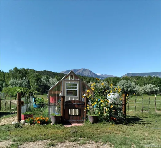 a view of a lake with sunset in the background
