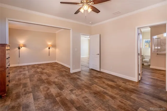 a view of an empty room and wooden floor