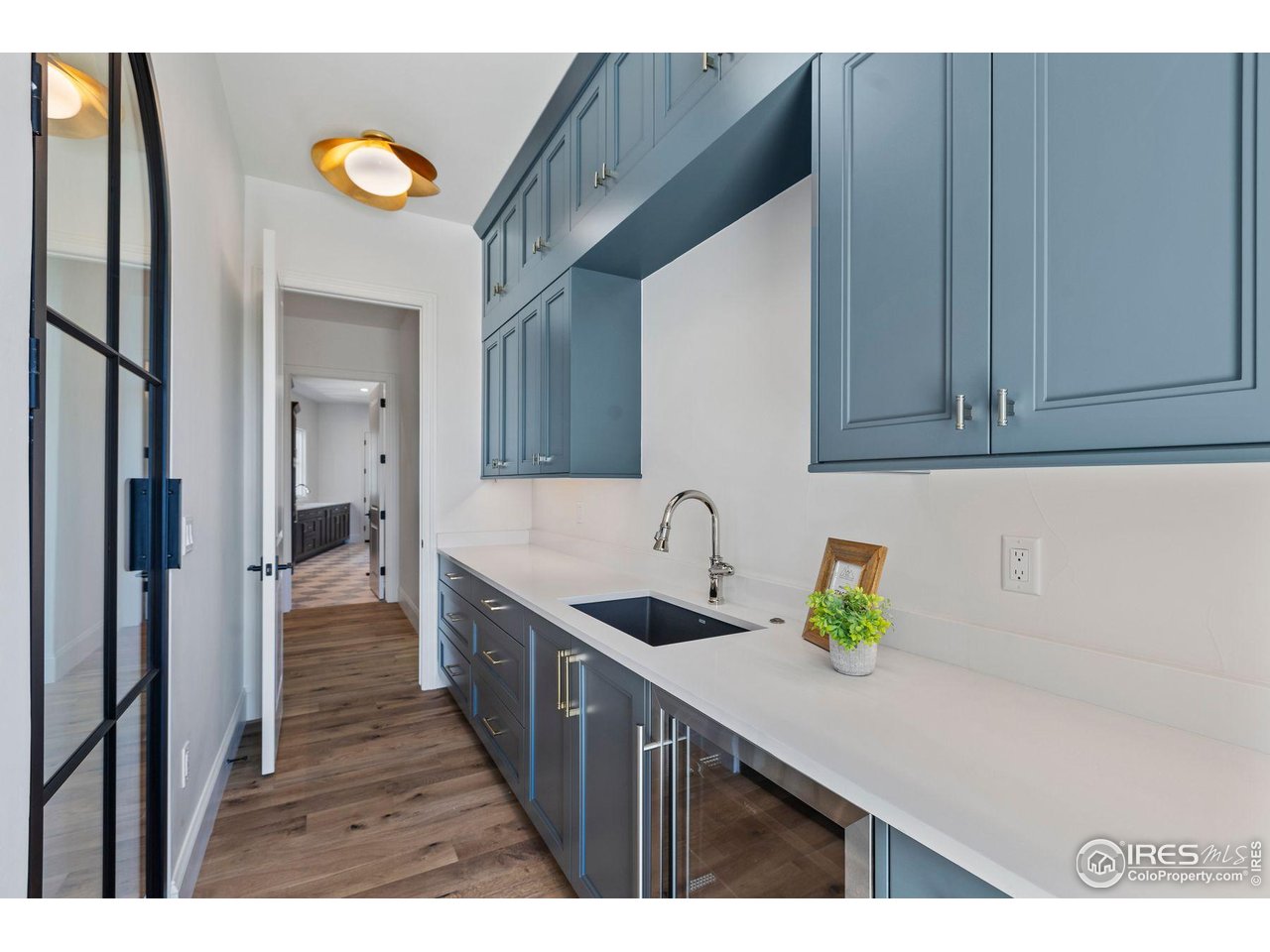 2568 Southwind Road Berthoud, CO 80513 - Photo 13 of 40 a kitchen with a sink and cabinets