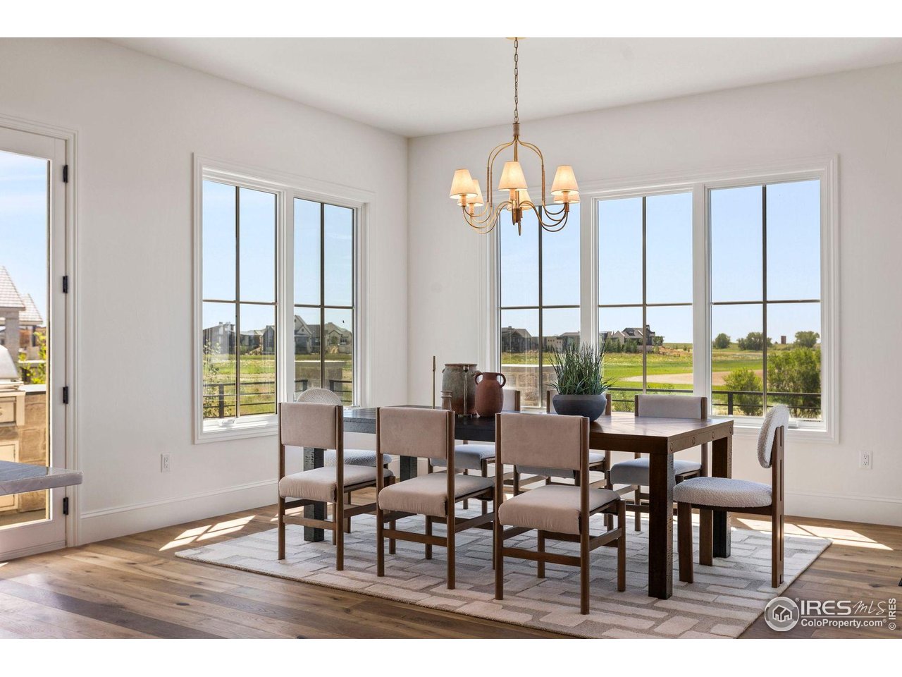 2568 Southwind Road Berthoud, CO 80513 - Photo 14 of 40 a view of a dining room with furniture window and outside view