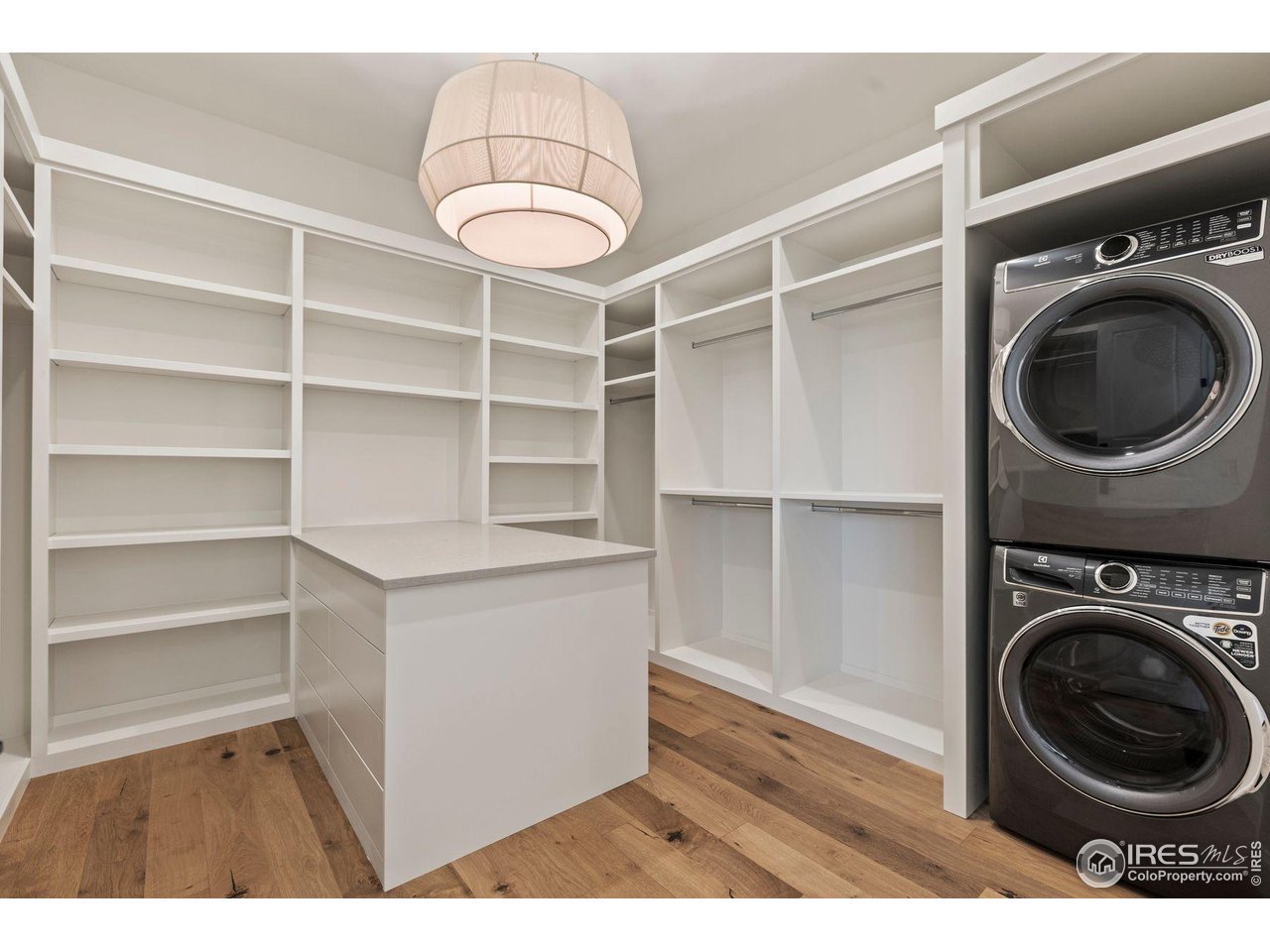 2568 Southwind Road Berthoud, CO 80513 - Photo 22 of 40 a view of a storage & utility room with washer and dryer