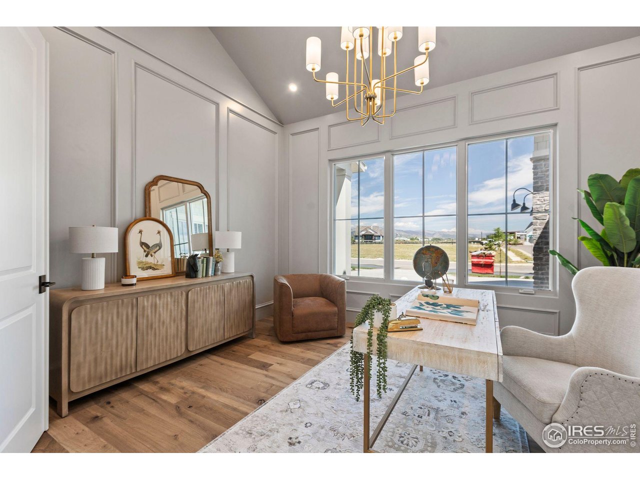 2568 Southwind Road Berthoud, CO 80513 - Photo 24 of 40 a living room with furniture a rug entryway and a large window