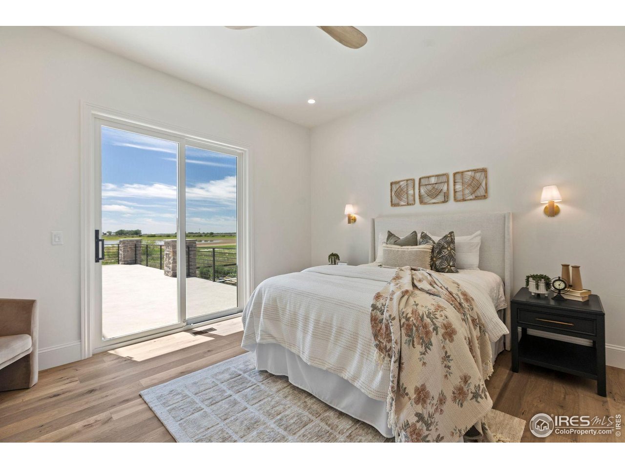 2568 Southwind Road Berthoud, CO 80513 - Photo 25 of 40 a bedroom with a bed and a large window
