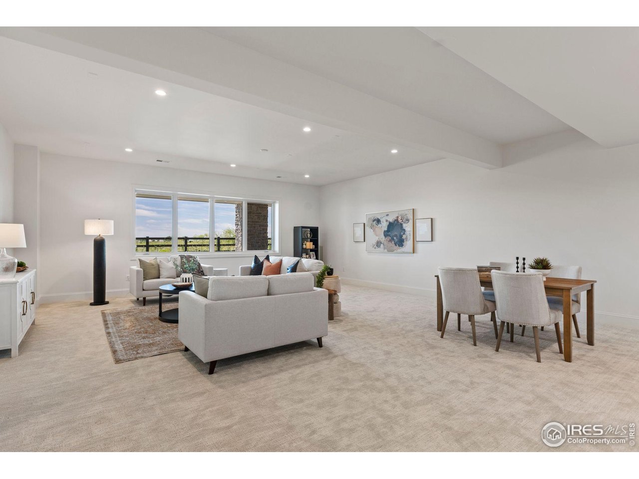 2568 Southwind Road Berthoud, CO 80513 - Photo 30 of 40 a living room with furniture and a dining table