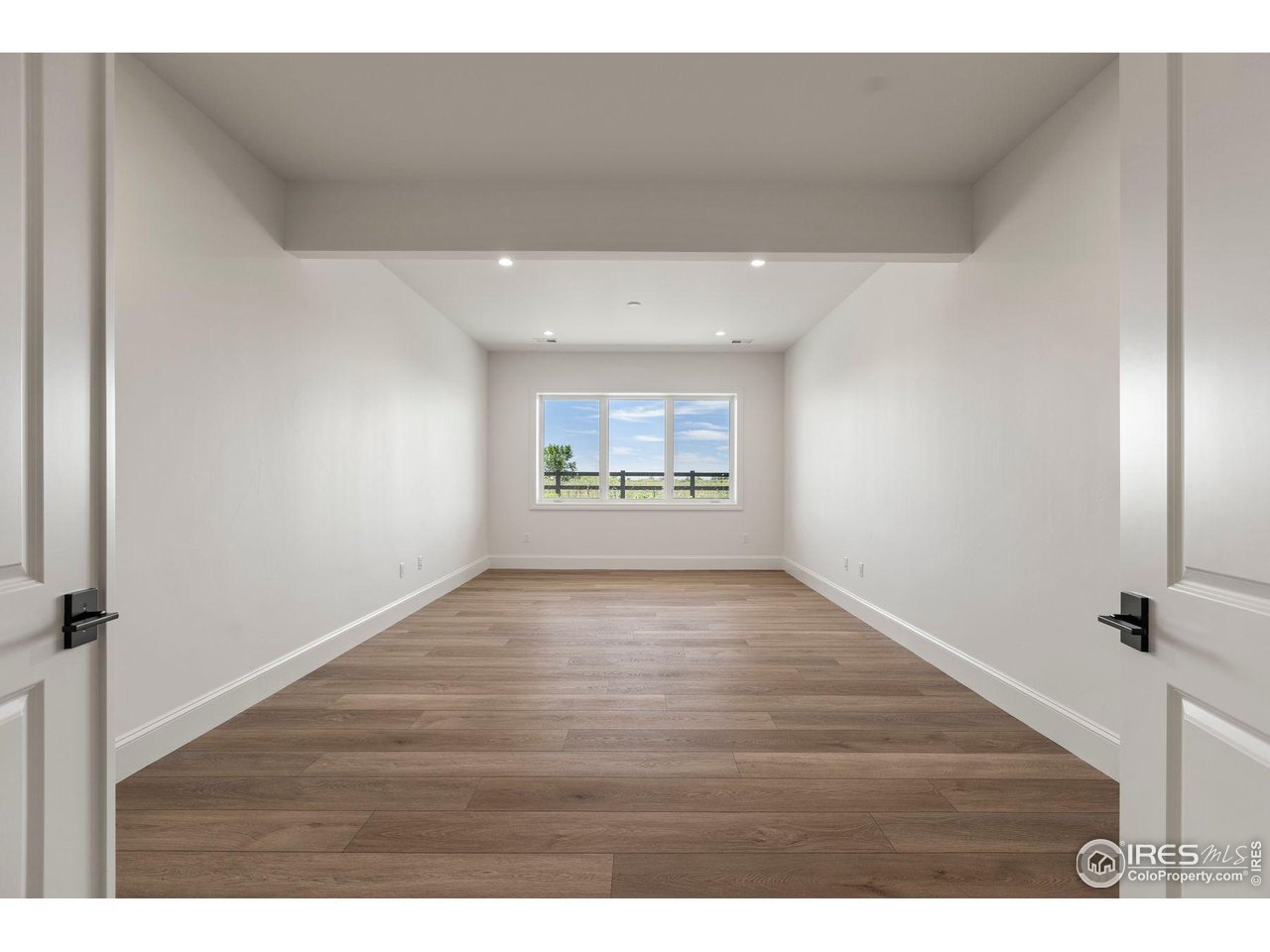 2568 Southwind Road Berthoud, CO 80513 - Photo 32 of 40 a view of an empty room and a window