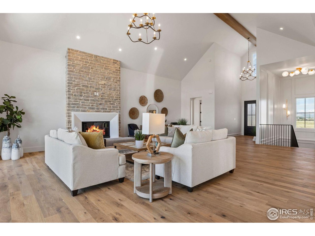 2568 Southwind Road Berthoud, CO 80513 - Photo 37 of 40 a living room with furniture and a fireplace