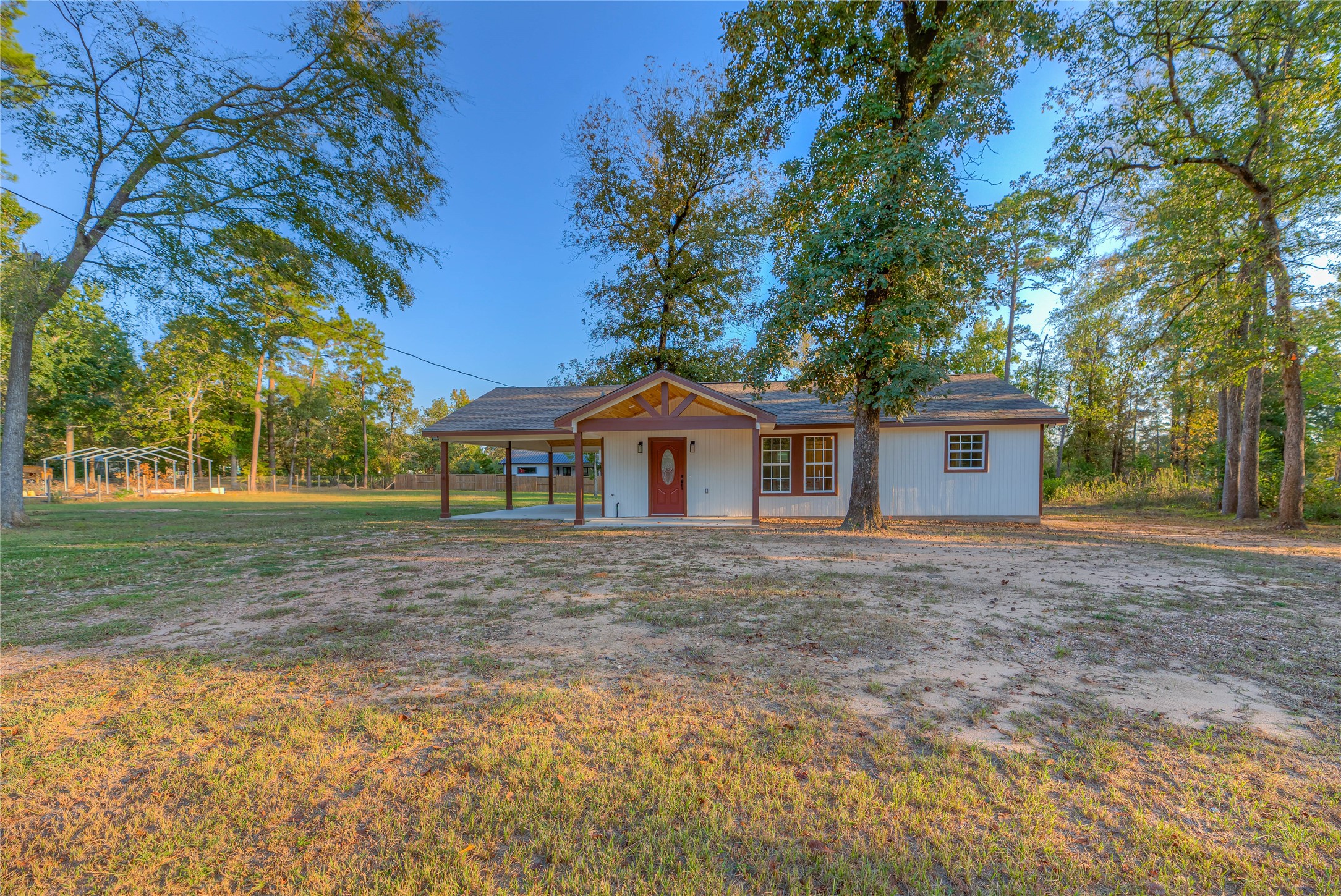 388 Sunrise Wood Road Goodrich, TX 77335 - Photo 24 of 33 a front view of a house with a yard and trees