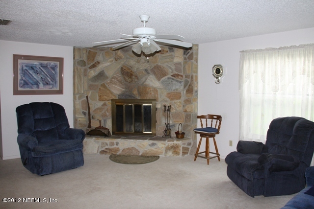 509 Carlin Road Satsuma, FL 32189 - Photo 11 of 26 Fireplace in livingroom
