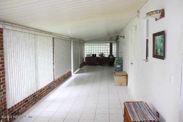 509 Carlin Road Satsuma, FL 32189 - Photo 20 of 26 Huge enclosed back porch with 2 sliders