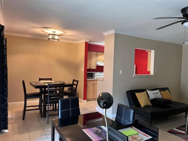 a view of a livingroom with furniture and a flat screen tv