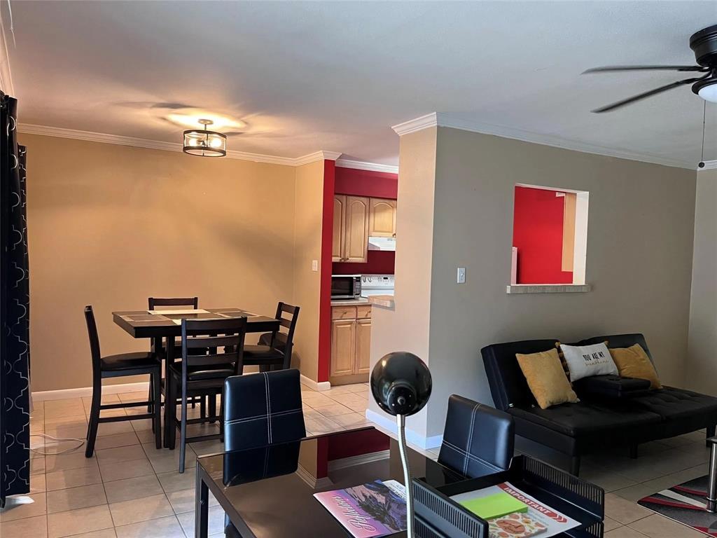 7000 Creswell Road, Unit 217 Shreveport, LA 71106 - Photo 4 of 17 a view of a dining room with furniture and wooden floor