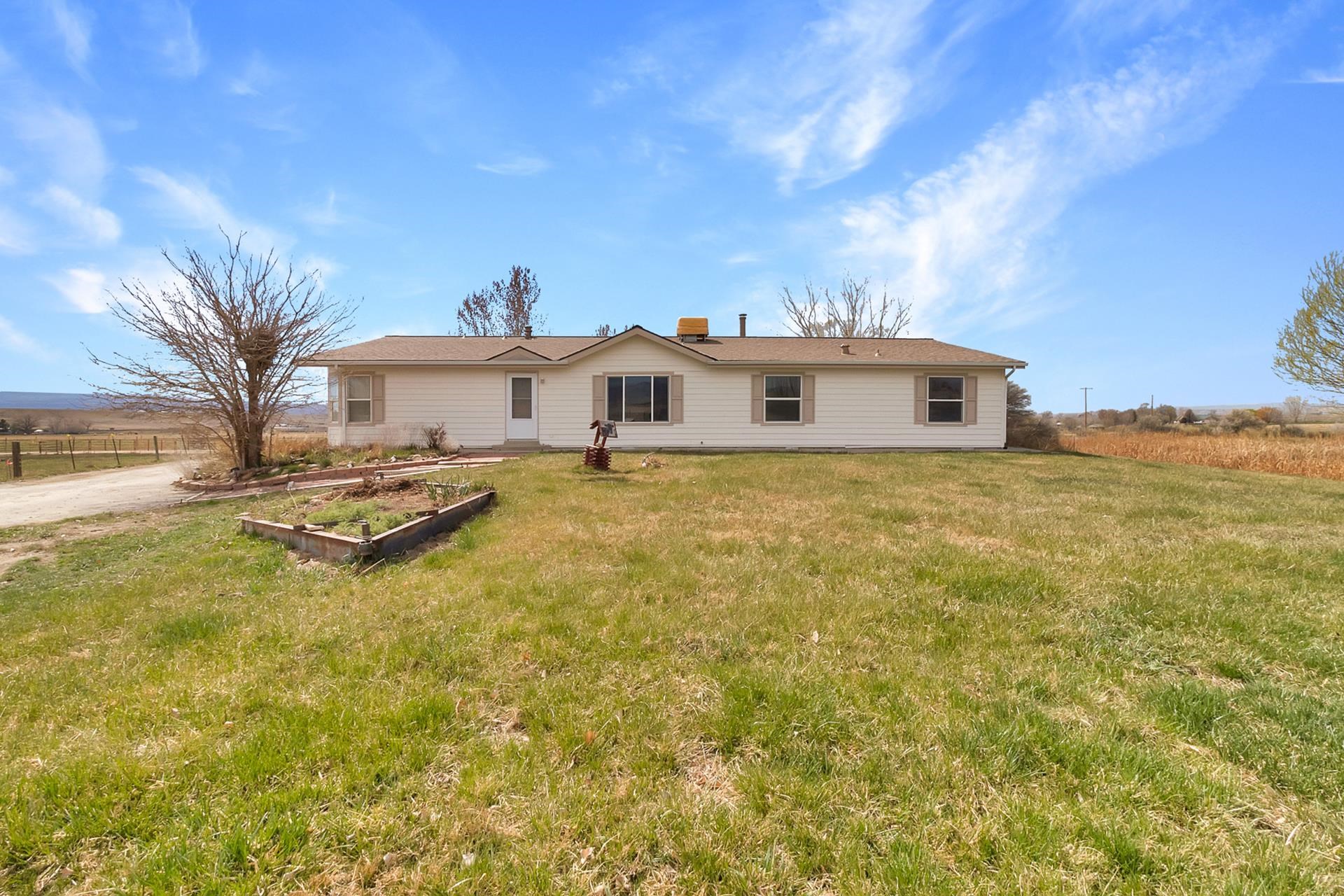 1940 10 Road Mack, CO 81525 - Photo 2 of 42 a house with swimming pool in front of it