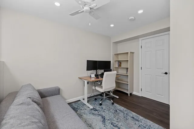 a workspace with furniture and wooden floor