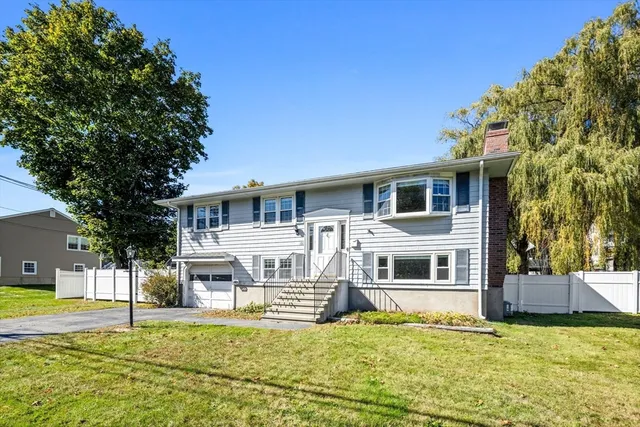 a house that has a big yard in front of it