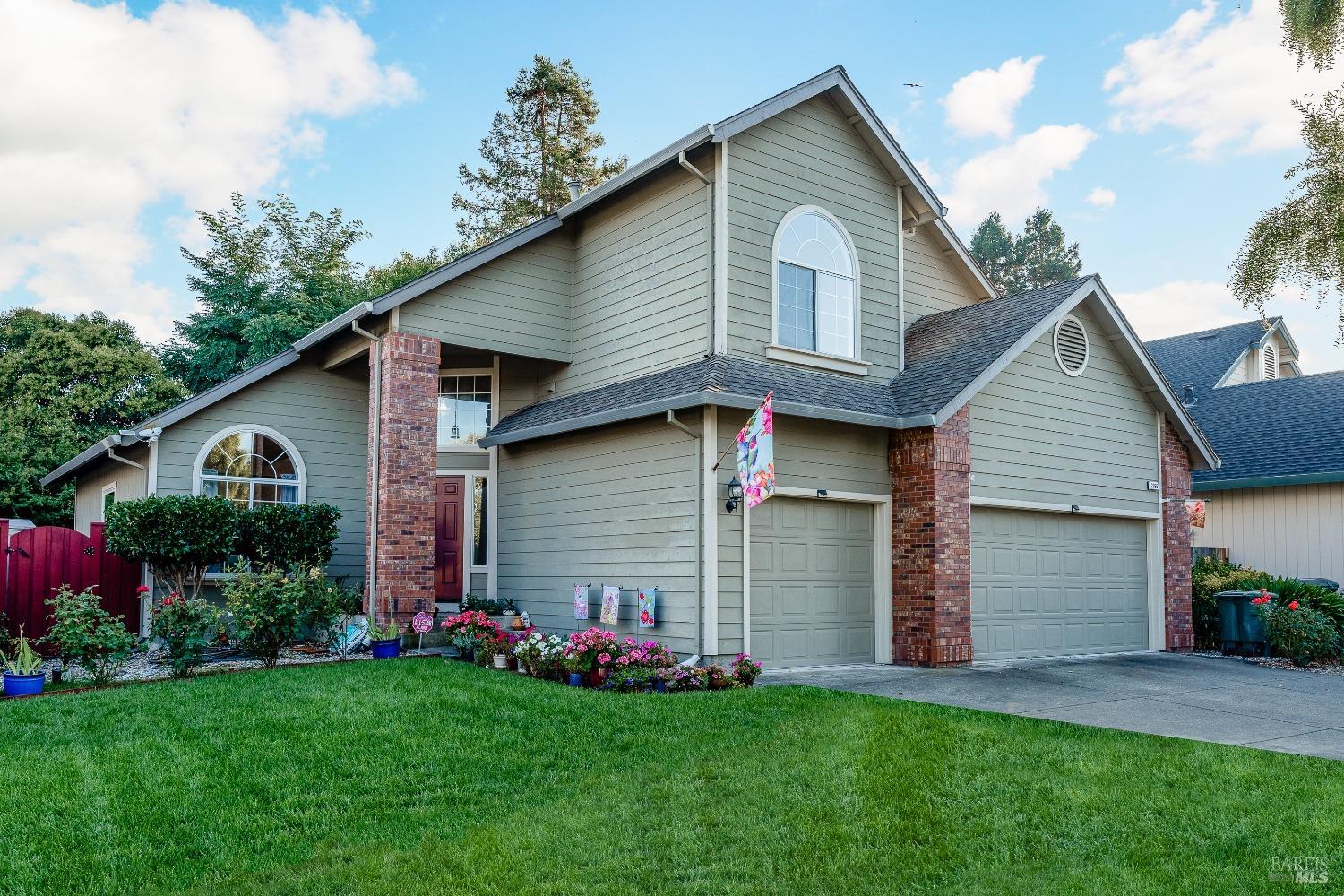 2096 Bock Street Santa Rosa, CA 95403 - Photo 1 of 1 a front view of a house with a garden and plants