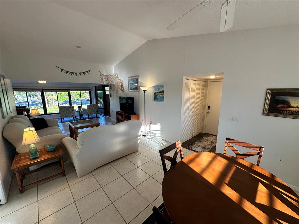 4578 Red Maple, Unit 904 Bradenton, FL 34210 - Photo 12 of 37 a living room with furniture and a flat screen tv