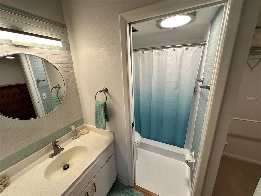 4578 Red Maple, Unit 904 Bradenton, FL 34210 - Photo 17 of 37 a bathroom with a sink a mirror and a bathtub