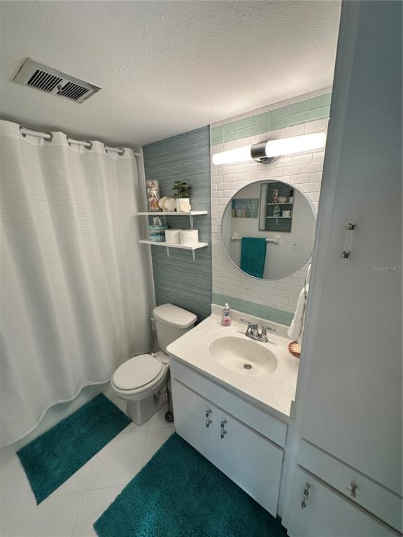 4578 Red Maple, Unit 904 Bradenton, FL 34210 - Photo 28 of 37 a bathroom with a sink toilet and shower