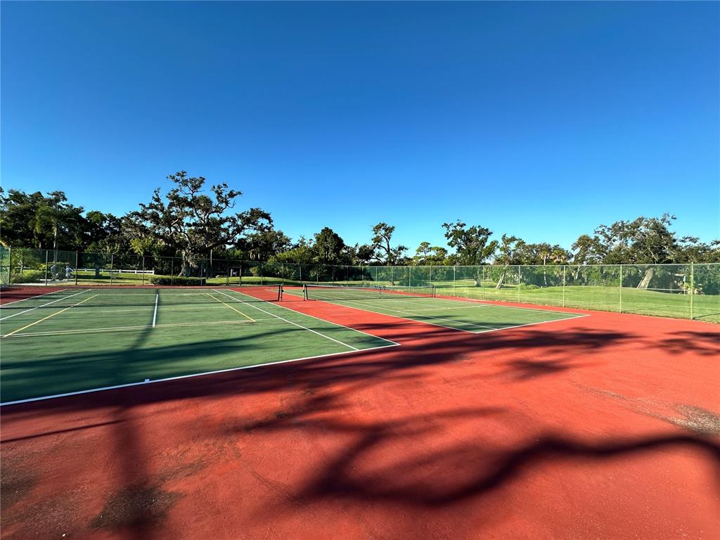 4578 Red Maple, Unit 904 Bradenton, FL 34210 - Photo 32 of 37 a view of a tennis court