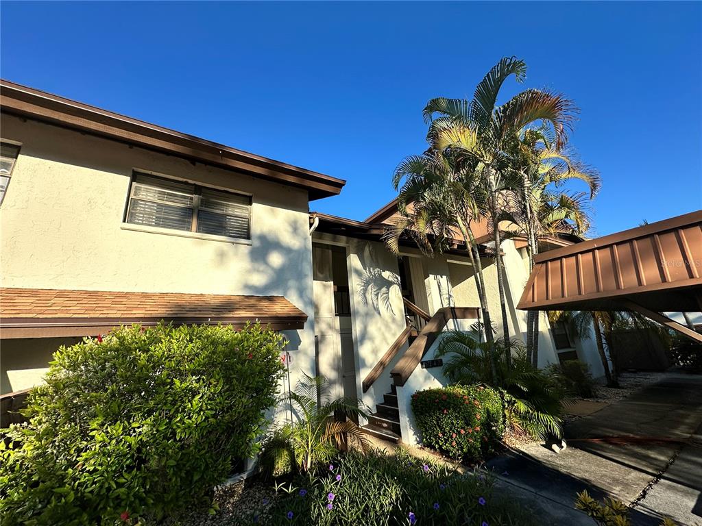 4578 Red Maple, Unit 904 Bradenton, FL 34210 - Photo 4 of 37 a backyard of a house with lots of green space