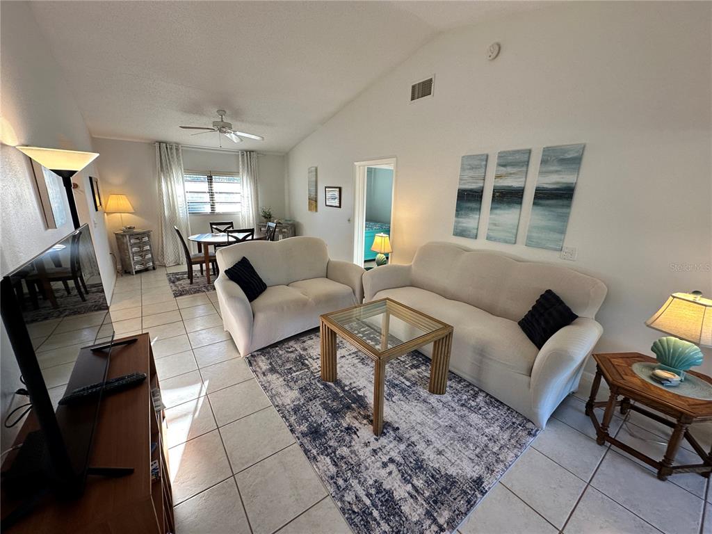4578 Red Maple, Unit 904 Bradenton, FL 34210 - Photo 10 of 37 a living room with furniture and a window
