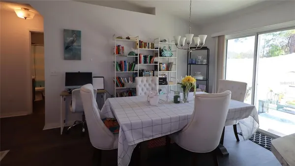 a view of a dining room with furniture window and outside view