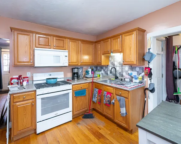 a kitchen with stainless steel appliances granite countertop a stove and a refrigerator