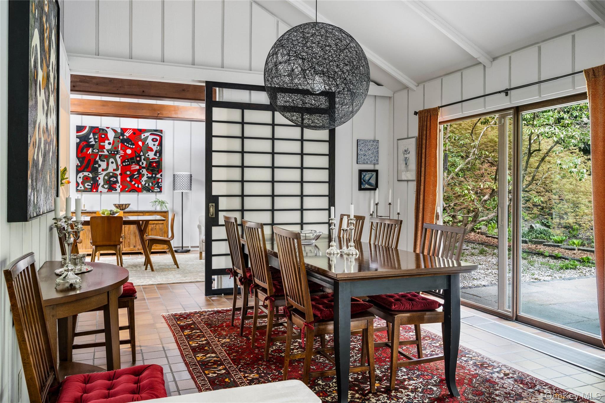 20 Lewis Road Irvington, NY 10533 - Photo 11 of 33 Sliding doors open to an expansive stone patio.