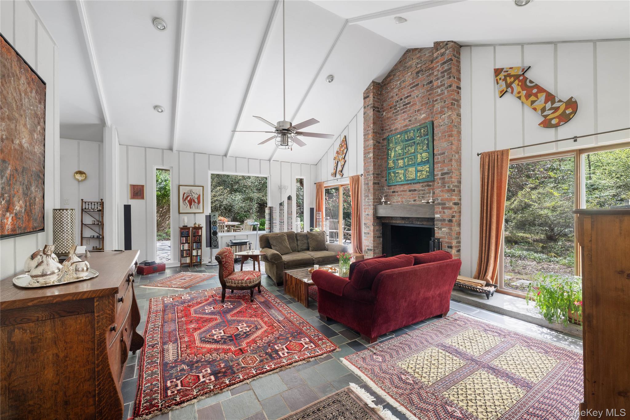 20 Lewis Road Irvington, NY 10533 - Photo 8 of 33 Soaring ceilings, a brick fireplace, bluestone floors enhance the living room.