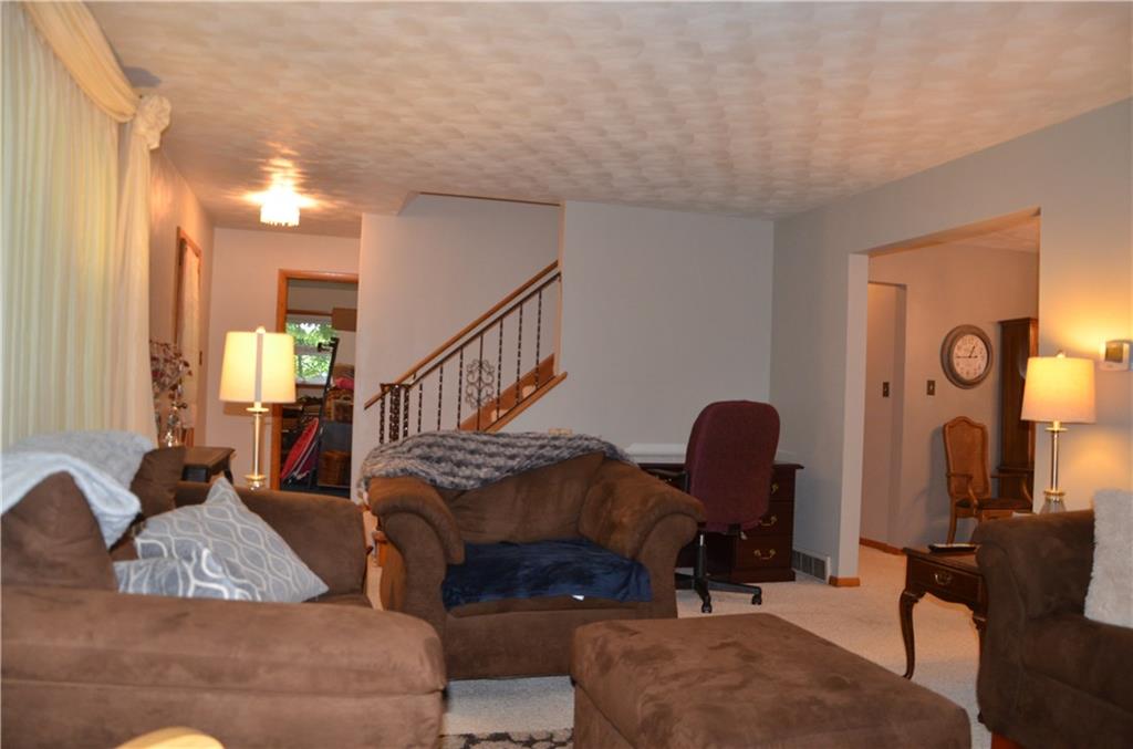 2345 Valley View Road Hermitage, PA 16148 - Photo 7 of 23 Living room. This picture shows the stairs leading to 2nd floor and a portion of the dining room
