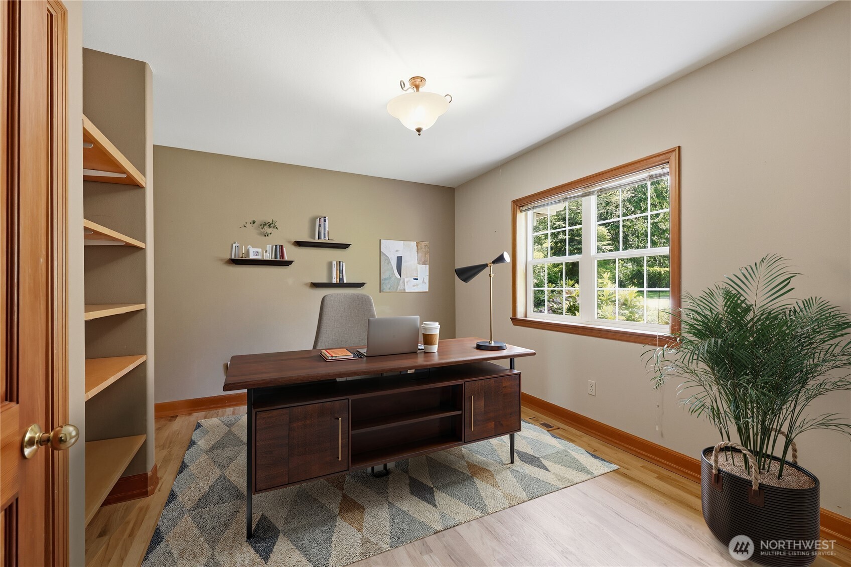 252 Jansen Road Nordland, WA 98358 - Photo 11 of 40 a room with a desk chair and a window