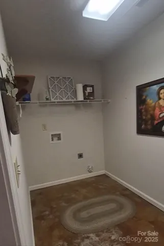 a view of storage and utility room with wooden floor
