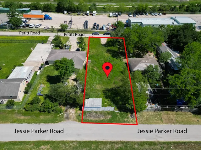 an aerial view of a house with a garden and lake view