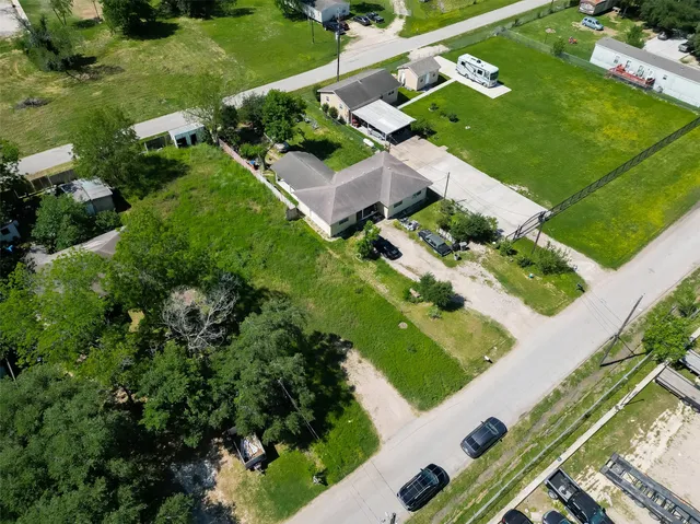 an aerial view of a house with a garden