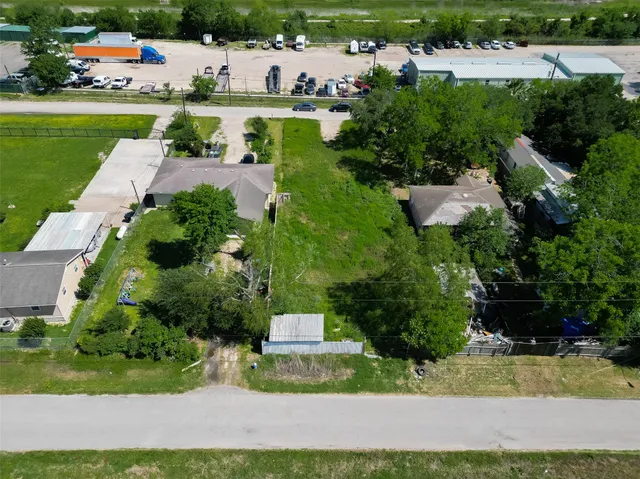 a view of a house with a yard and lake view