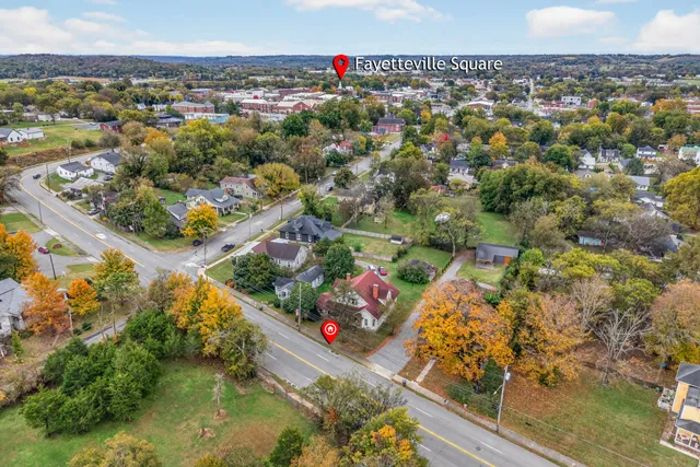 an aerial view of residential houses with outdoor space