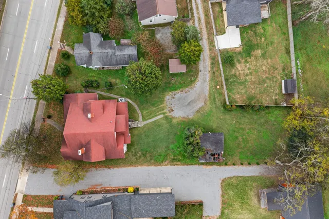 an aerial view of residential house with outdoor space and parking