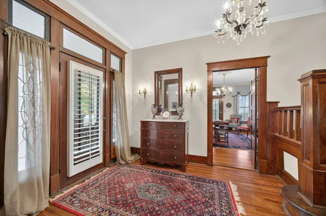 a view of a livingroom with furniture and staircase
