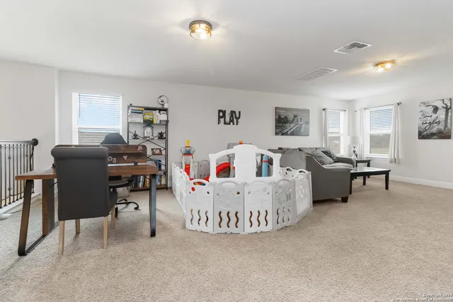 a living room with furniture and a table