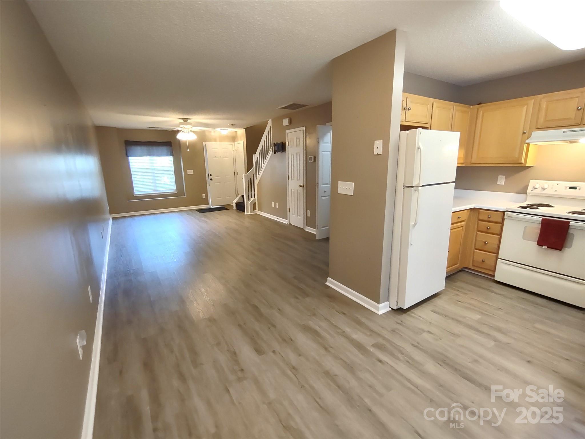 8338 Rudolph Road Charlotte, NC 28216 - Photo 4 of 15 a view of kitchen with furniture and wooden floor
