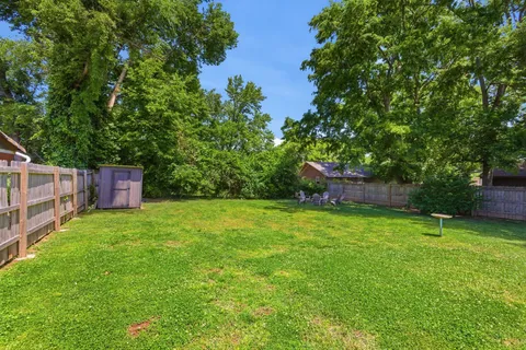 a backyard of a house with lots of green space