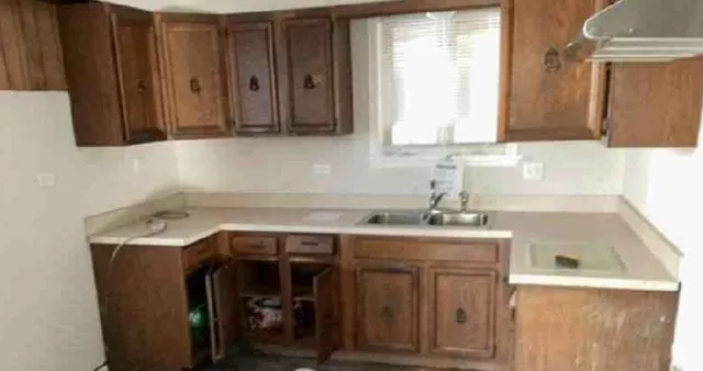 a utility room with a sink a washer and dryer